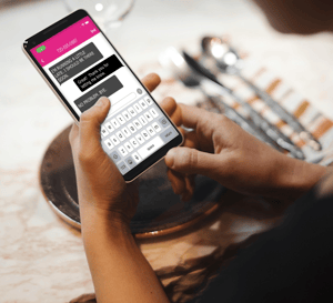 Image of a mobile phone being used for Relay services through text.