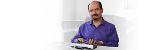 African American male using a Telebraille machine.